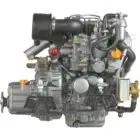 A compact diesel engine with various components and hoses is displayed against white background.